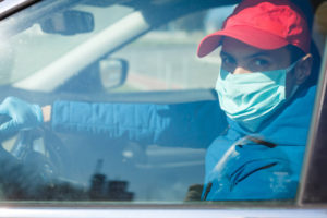 man wearing mask and gloves during COVID-19